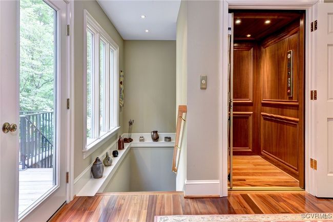 Steps to the lower level garage and elevator. | Image 16