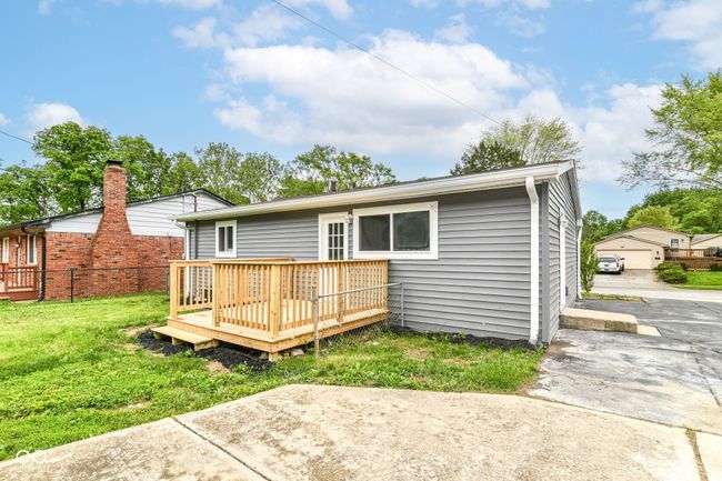back of property featuring a wooden deck | Image 33