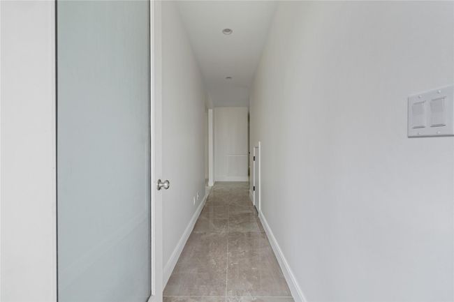Hall featuring baseboards | Image 4
