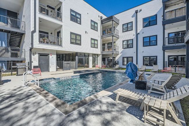 Community pool with grilling area and a patio area | Image 32