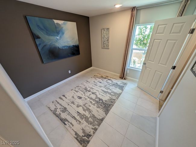 Foyer with light tile patterned floors and recessed lighting | Image 15