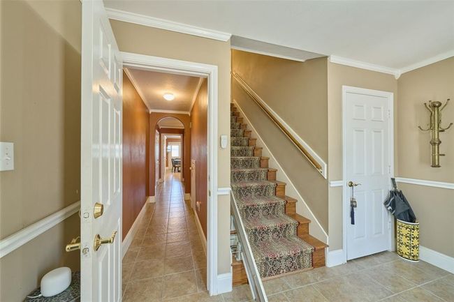 Entrance to guest suite downstairs and Stairs up to the private main living on the 2nd level. Chair lift included | Image 7