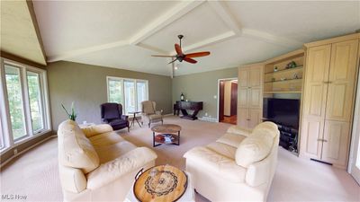 Living room featuring light colored carpet, plenty of natural light, and ceiling fan | Image 3