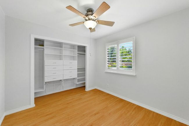 Rear Bedroom with closet storage built-ins | Image 33