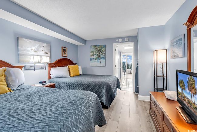 Bedroom featuring light wood-style floors | Image 7