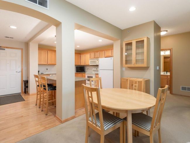 Informal dining area with cabinets. | Image 9