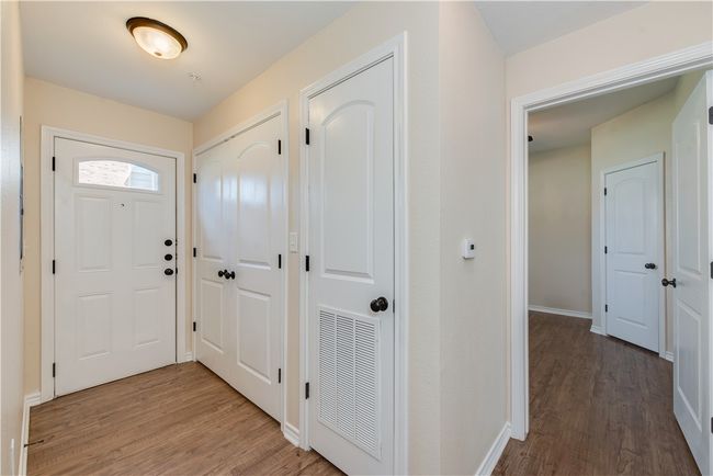 Foyer featuring wood finished floors, visible vents, and baseboards | Image 13