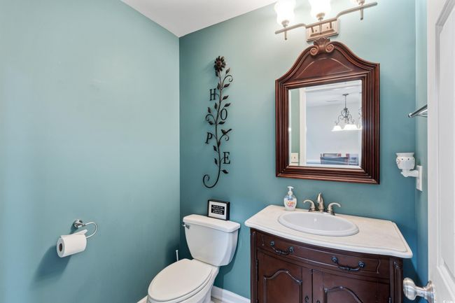 Bathroom featuring toilet and vanity | Image 30