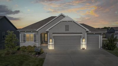 View of front facade featuring a garage | Image 1