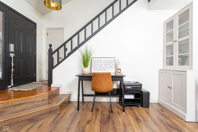 office space with wood finished floors and vaulted ceiling | Image 5