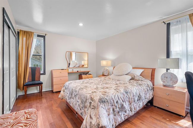 Bedroom featuring wood-type flooring, recessed lighting, and a closet | Image 17