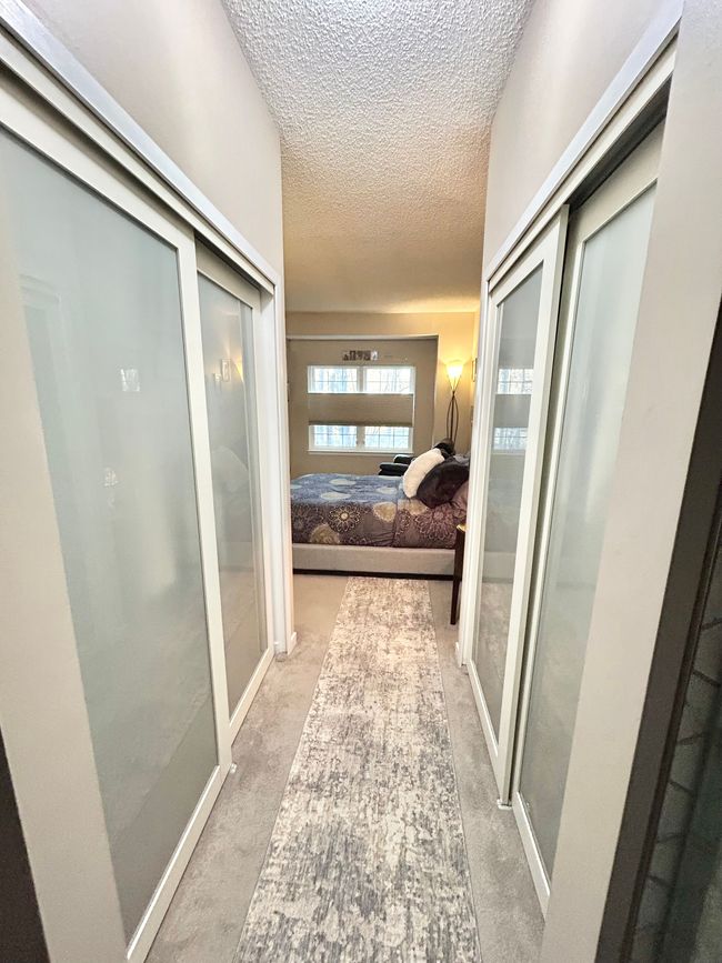 Dual closets with privacy glass on sliding doors | Image 27