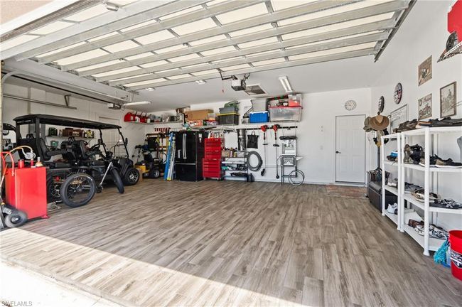 Garage with a garage door opener | Image 36