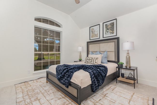 Bedroom featuring carpet floors, lofted ceiling, and ceiling fan | Image 28