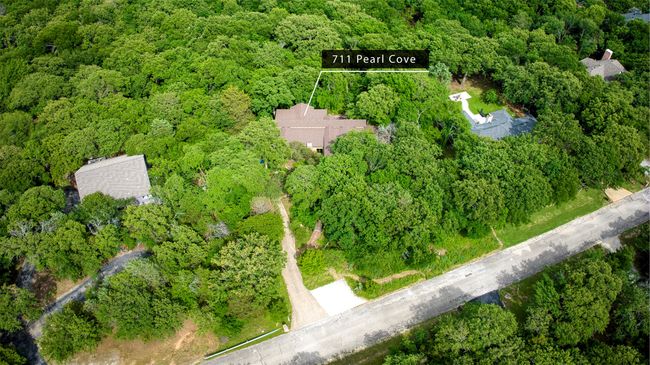 Aerial view of property and surrounding area featuring green space. | Image 36