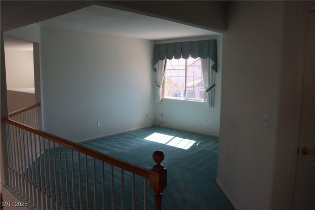 Carpeted empty room featuring baseboards | Image 40