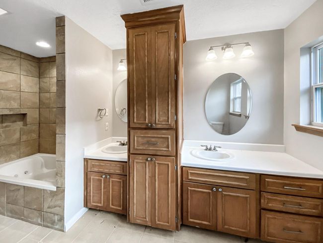 Master bathroom with double sinks and a soaking tub/shower combo. | Image 12