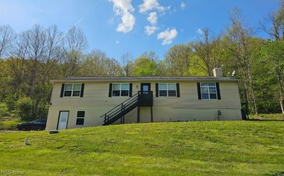 View of front of house featuring a front lawn | Image 1