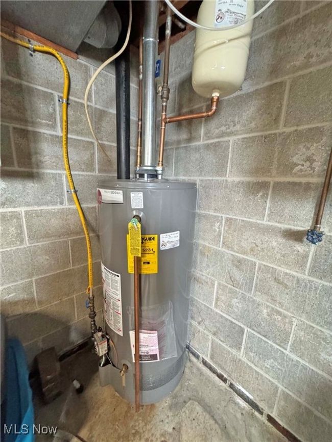 Utility room featuring water heater | Image 43