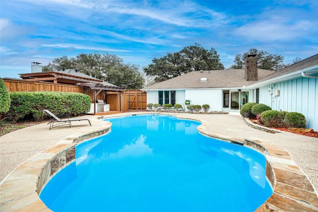 View of pool featuring a patio, a fenced backyard, and a pergola | Image 24