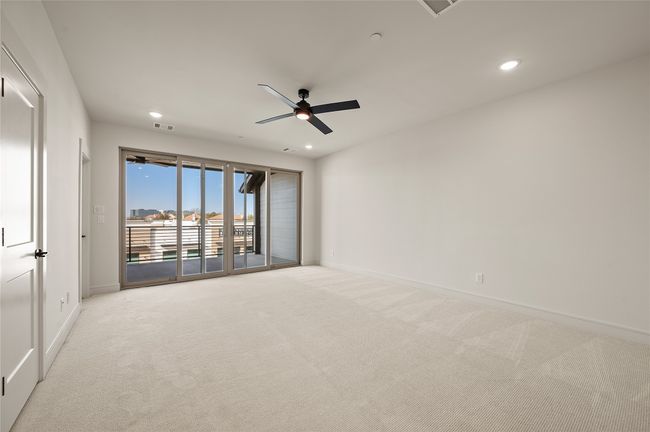 This spacious game room paired with a covered, outdoor deck creates the perfect entertainment zone. | Image 16