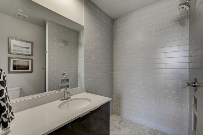 Full bathroom with a tile shower and vanity | Image 17