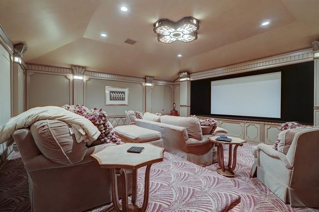Third floor home theatre. The walls are acoustical panels, custom lighting, tiered seating, wool Stark Carpets. A lot of custom detailed was put into this theatre. | Image 39