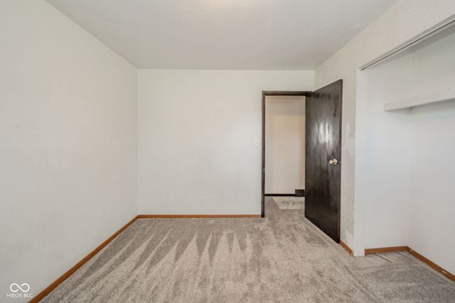 empty room featuring carpet floors and baseboards | Image 19
