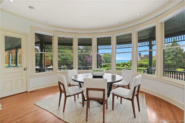 BREAKFAST ROOM // Sweeping views with access to veranda and family room. | Image 9