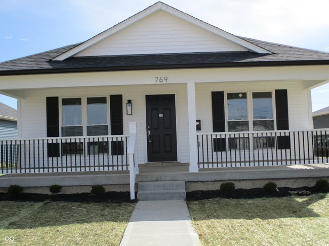 bungalow with covered porch and a shingled roof | Image 19