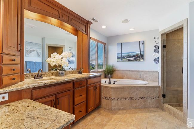 Full bath with tile patterned flooring, visible vents, a sink, and a garden tub | Image 36