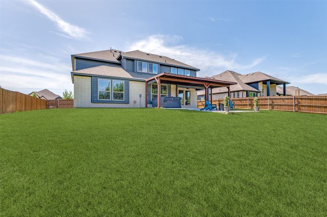 Back of house with a fenced backyard, brick siding, a patio area, and a shingled roof | Image 39