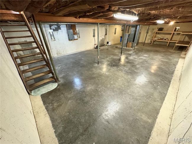 Unfinished below grade area featuring electric panel | Image 29