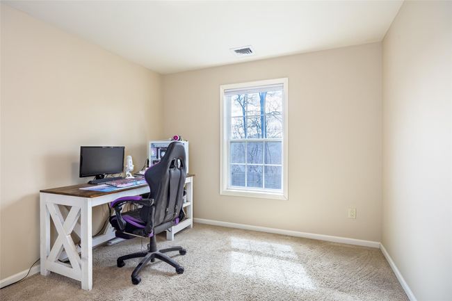 Carpeted office space featuring baseboards and visible vents | Image 20