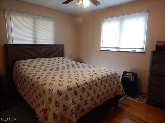 Bedroom 2 with wood finished floors and a ceiling fan | Image 19