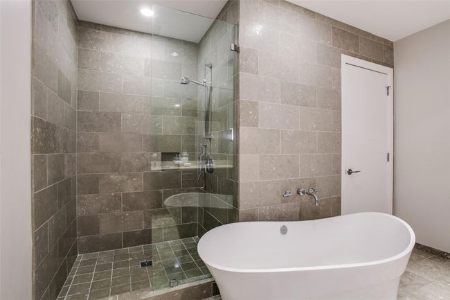 Separate soaking tub & shower in primary bathroom. | Image 24