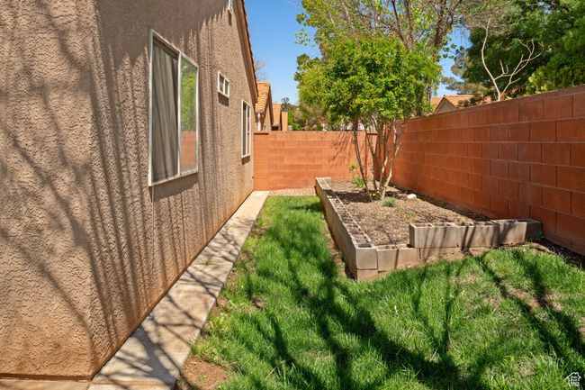 View of yard with a garden and a fenced backyard | Image 21