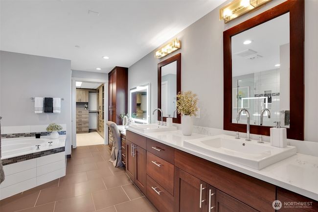 Dual sinks and vanity area plus ample storage for all your personal needs. | Image 12