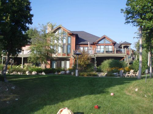 6579 Woods Creek Dr, Charlevoix, MI, 49720-9395 | Card Image