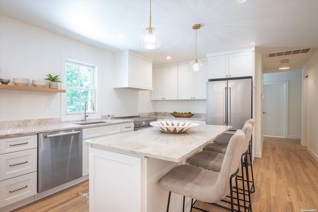 Center Island w/ Taj Mahal Quartzite Counters | Image 8