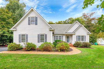 View of property featuring a front lawn | Image 1