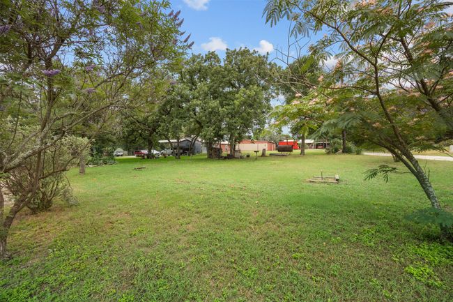 Corner Lot has 3 septic tanks. Be ready to entertain with BBQ area and horseshoes! | Image 22