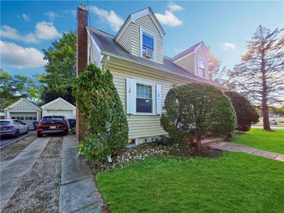 front view, including the garage and driveway | Image 3