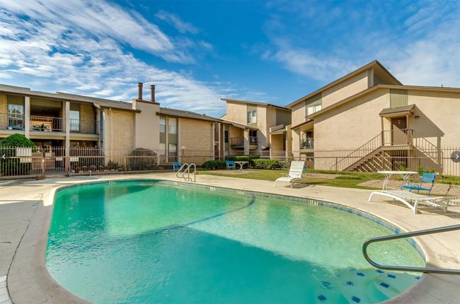 Community pool with a patio area | Image 19