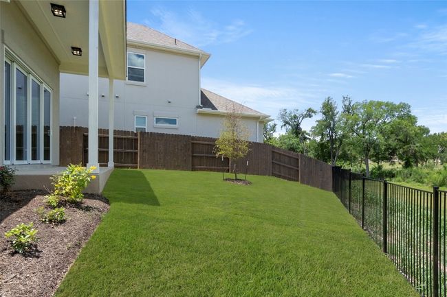View of fenced backyard | Image 36