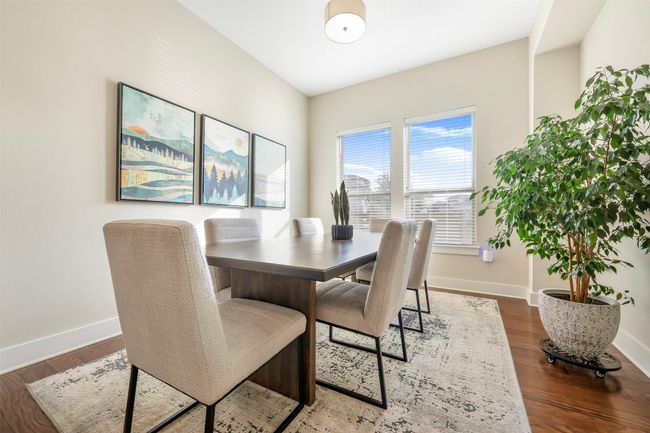 Dining space featuring baseboards and wood finished floors | Image 12
