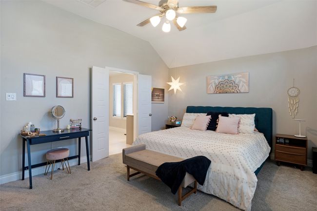 Bedroom with carpet flooring, lofted ceiling, and ceiling fan | Image 20