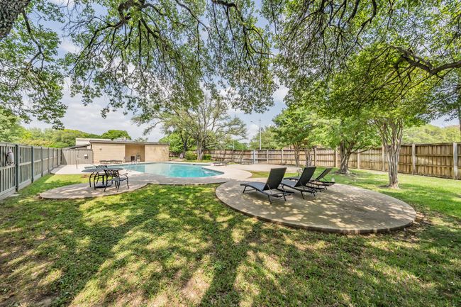 View of yard featuring a patio area, a fenced backyard, and a fenced in pool | Image 25