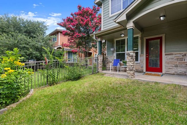 View of Patio from corner of private yard. Note - wrought iron fence and gate. | Image 31