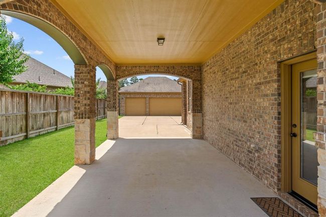 The port cochere allowing ample parking with access to the house . | Image 40